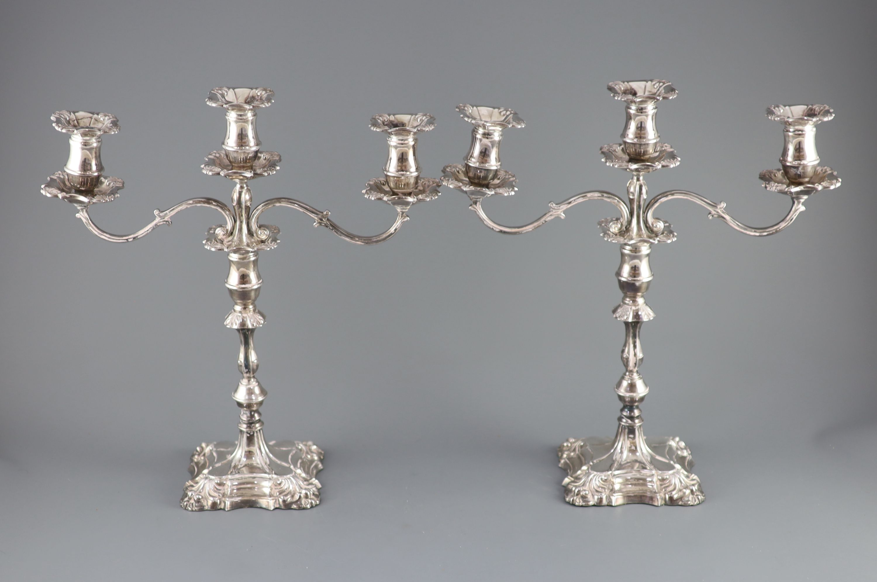 A modern pair of silver two branch, three light candelabra by Roberts & Belk